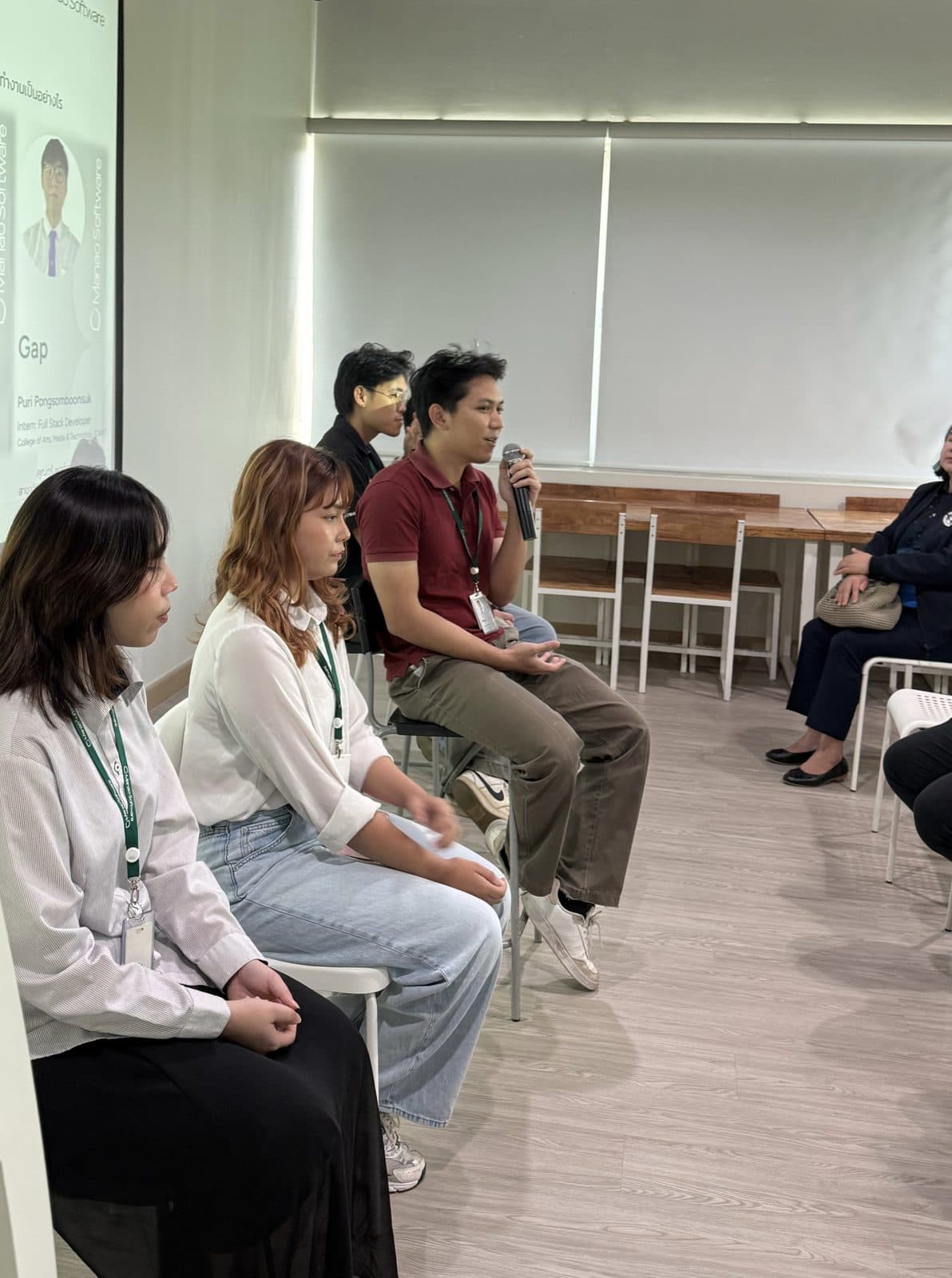 Buk presenting AI-integrated UX/UI to an audience in Chiang Mai