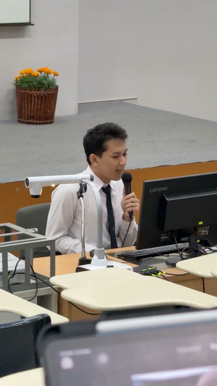 Buk presenting a project in class at MFU